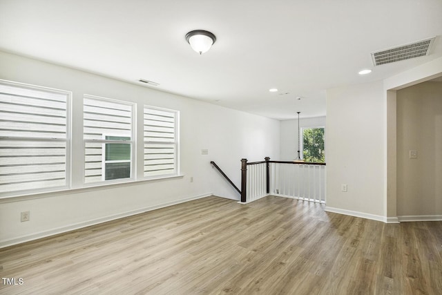 261 Begen St, Morrisville, NC 27560 - spare room featuring wood finished floors and recessed lighting