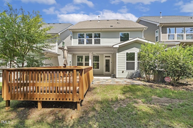 261 Begen St, Morrisville, NC 27560 - back of house with a deck, a patio, and a lawn