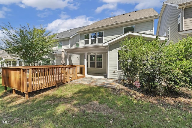 261 Begen St, Morrisville, NC 27560 - back of house with a wooden deck and a lawn