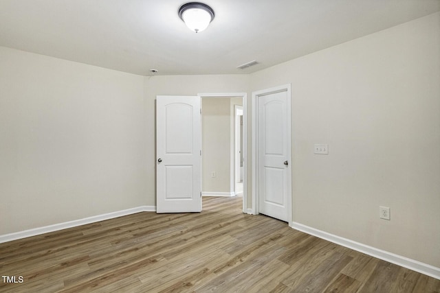 261 Begen St, Morrisville, NC 27560 - unfurnished room featuring wood finished floors and baseboards
