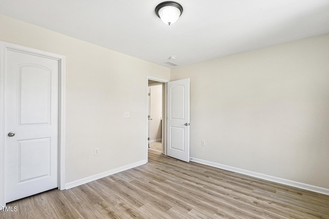 261 Begen St, Morrisville, NC 27560 - unfurnished bedroom featuring light wood-style floors and baseboards