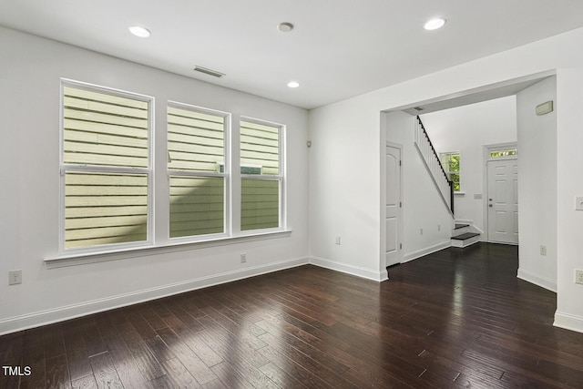261 Begen St, Morrisville, NC 27560 - unfurnished room with stairway, hardwood / wood-style floors, and recessed lighting
