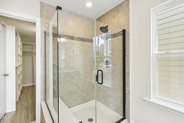 261 Begen St, Morrisville, NC 27560 - bathroom with a shower stall, wood finished floors, a walk in closet, and recessed lighting