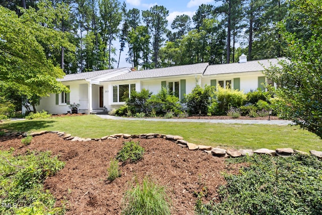 317 Reade Rd, Chapel Hill, NC 27516 - ranch-style house with a front yard and a chimney