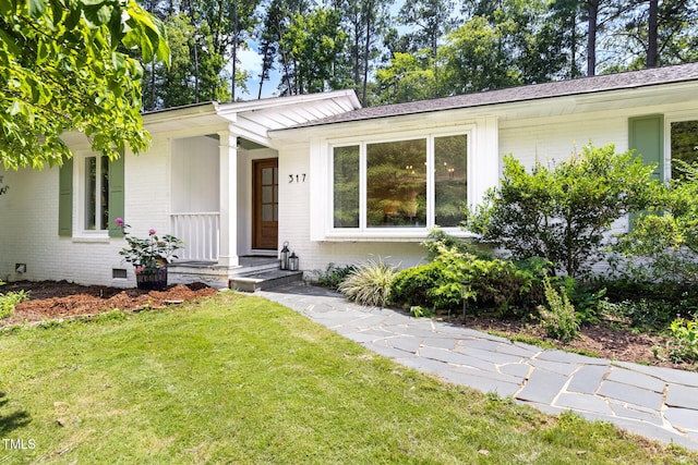 317 Reade Rd, Chapel Hill, NC 27516 - single story home featuring brick siding, a front yard, crawl space, and roof with shingles
