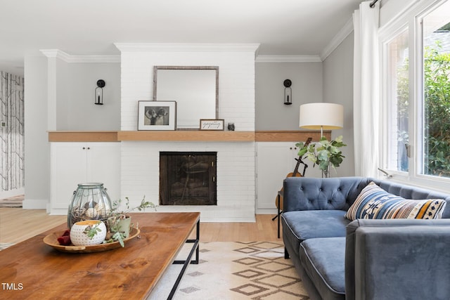 317 Reade Rd, Chapel Hill, NC 27516 - living area featuring light wood-style flooring, ornamental molding, and a brick fireplace
