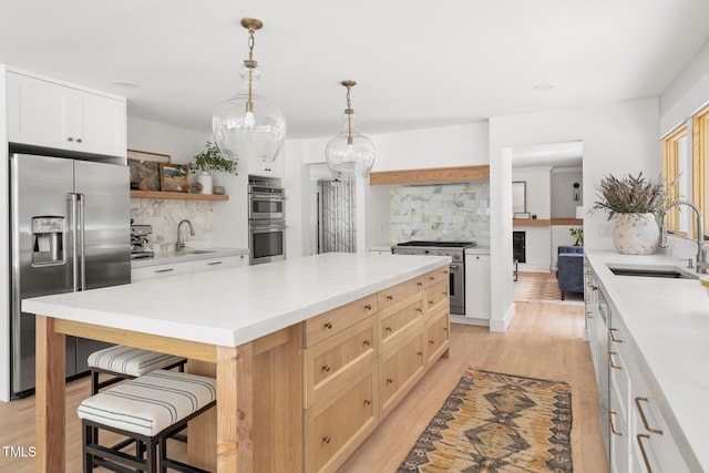 317 Reade Rd, Chapel Hill, NC 27516 - kitchen with high quality appliances, tasteful backsplash, a breakfast bar area, and open shelves
