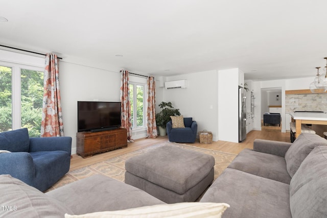 317 Reade Rd, Chapel Hill, NC 27516 - living area with an AC wall unit and light wood-style flooring