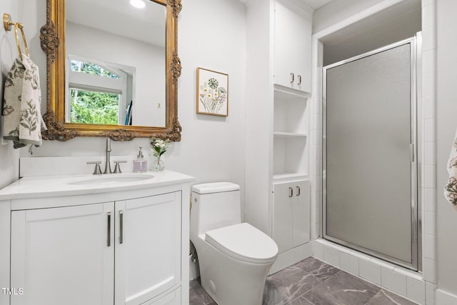 317 Reade Rd, Chapel Hill, NC 27516 - bathroom featuring marble finish flooring, vanity, a shower stall, and built in shelves
