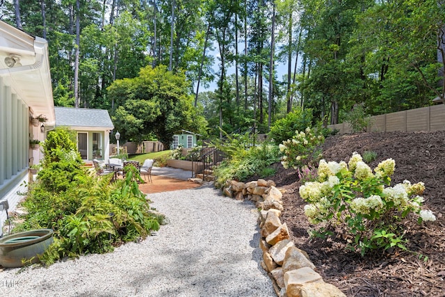 317 Reade Rd, Chapel Hill, NC 27516 - view of yard featuring view of wooded area and a patio