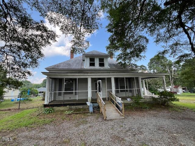 401 Division St, Norlina, NC 27563 - farmhouse-style home featuring a sunroom and a chimney