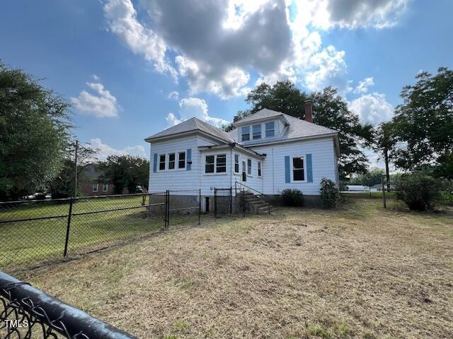 401 Division St, Norlina, NC 27563 - rear view of property featuring a chimney