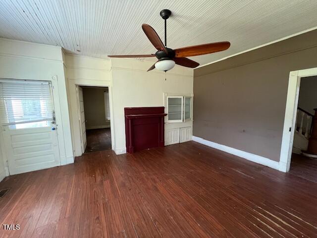 401 Division St, Norlina, NC 27563 - unfurnished living room featuring ceiling fan and wood finished floors