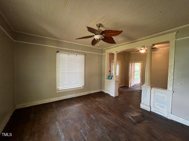 401 Division St, Norlina, NC 27563 - spare room with decorative columns, a ceiling fan, dark wood-style floors, and crown molding
