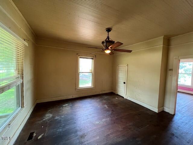 401 Division St, Norlina, NC 27563 - empty room with dark wood-style floors and a ceiling fan