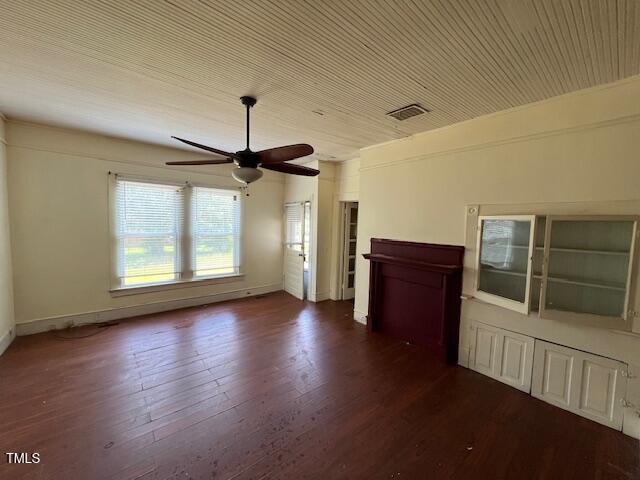 401 Division St, Norlina, NC 27563 - unfurnished living room featuring ceiling fan and dark wood finished floors