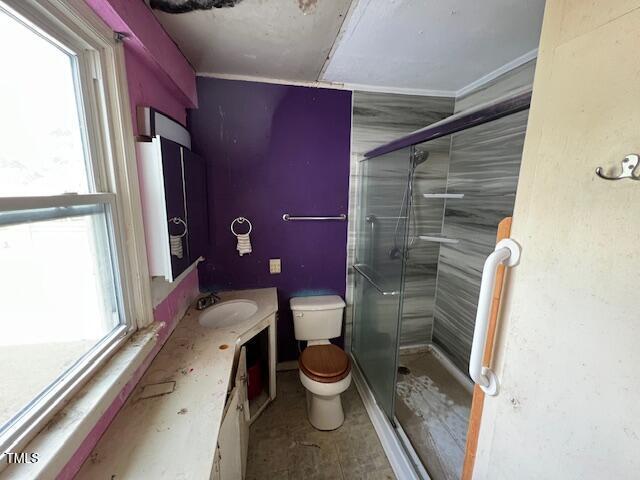 401 Division St, Norlina, NC 27563 - bathroom with a stall shower, vanity, and ornamental molding