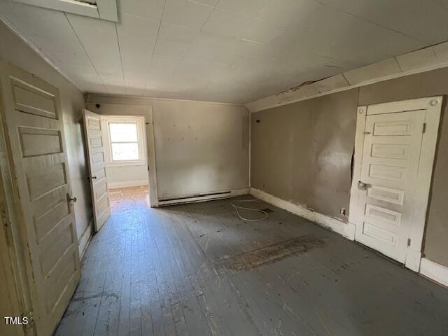 401 Division St, Norlina, NC 27563 - empty room featuring baseboards and hardwood / wood-style flooring