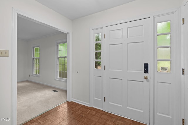 5313 Falkirk Dr, Durham, NC 27712 - foyer entrance with dark carpet and crown molding