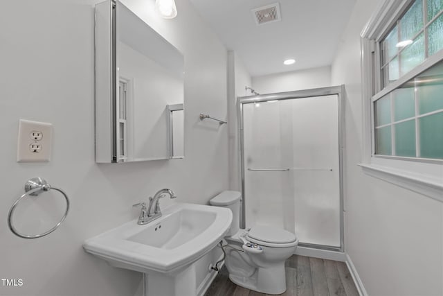5313 Falkirk Dr, Durham, NC 27712 - bathroom with wood finished floors and a stall shower