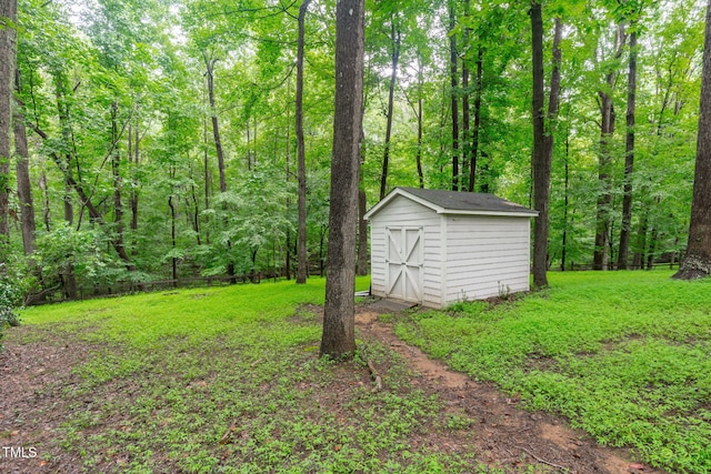 5313 Falkirk Dr, Durham, NC 27712 - view of green lawn featuring a shed and a wooded view