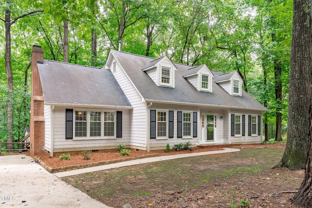 5313 Falkirk Dr, Durham, NC 27712 - new england style home featuring a chimney and view of wooded area