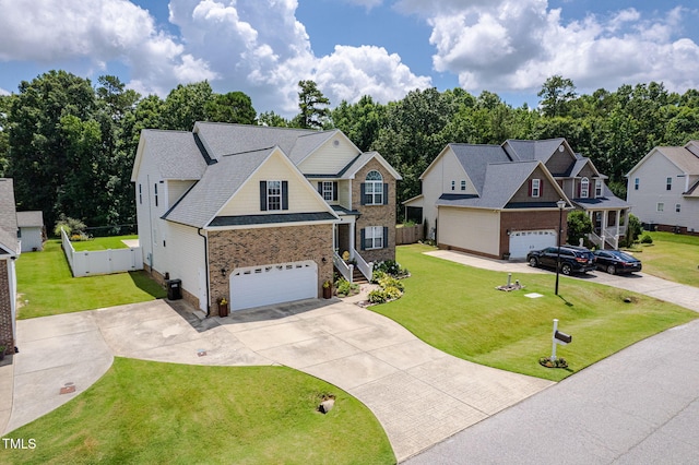 171 Winding Oak Way, Clayton, NC 27520 - view of front of property with driveway, brick siding, a garage, and a shingled roof