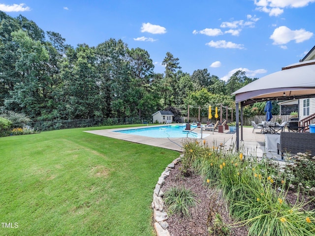 171 Winding Oak Way, Clayton, NC 27520 - view of pool featuring a gazebo, a fenced backyard, a patio area, a storage unit, and view of scattered trees