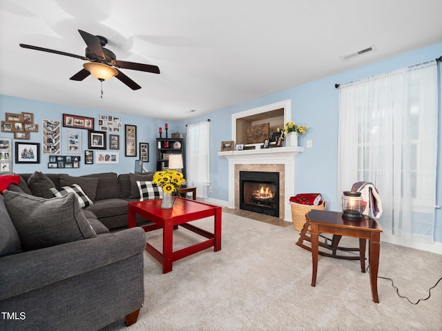 171 Winding Oak Way, Clayton, NC 27520 - living area featuring ceiling fan, a tile fireplace, and light colored carpet
