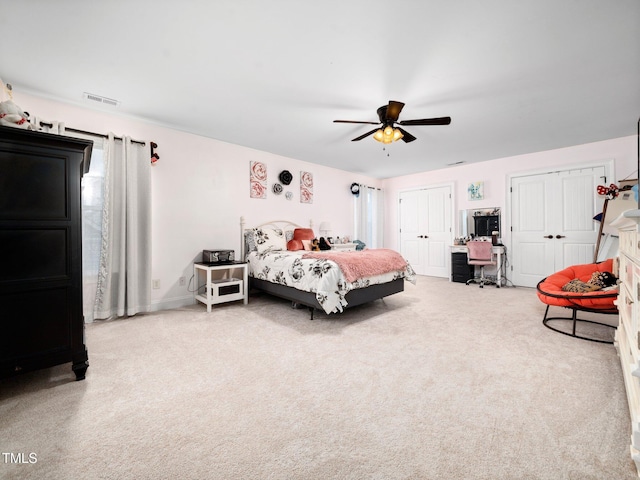 171 Winding Oak Way, Clayton, NC 27520 - carpeted bedroom featuring multiple closets, an office area, and ceiling fan
