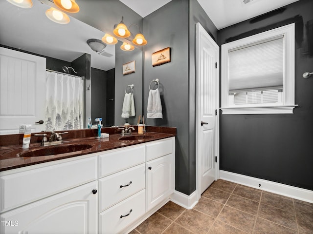 171 Winding Oak Way, Clayton, NC 27520 - bathroom featuring double vanity, tile patterned floors, and curtained shower