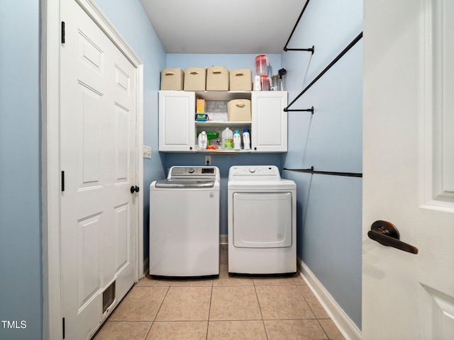 171 Winding Oak Way, Clayton, NC 27520 - washroom with cabinet space, washer and dryer, and light tile patterned flooring