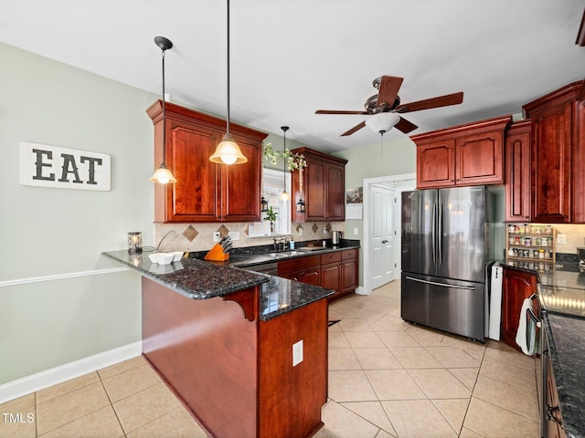 171 Winding Oak Way, Clayton, NC 27520 - kitchen with freestanding refrigerator, a peninsula, backsplash, a ceiling fan, and light tile patterned flooring