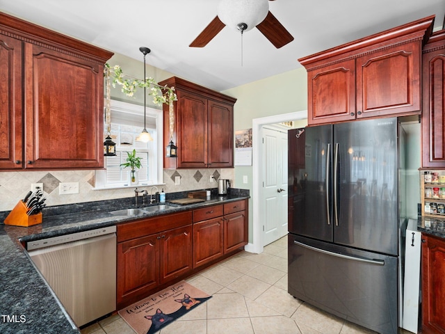 171 Winding Oak Way, Clayton, NC 27520 - kitchen with appliances with stainless steel finishes, a ceiling fan, tasteful backsplash, and decorative light fixtures