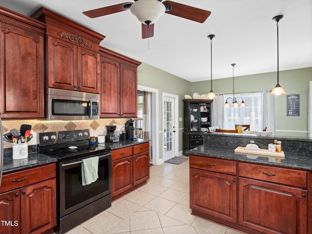 171 Winding Oak Way, Clayton, NC 27520 - kitchen with black electric range, stainless steel microwave, ceiling fan, backsplash, and plenty of natural light
