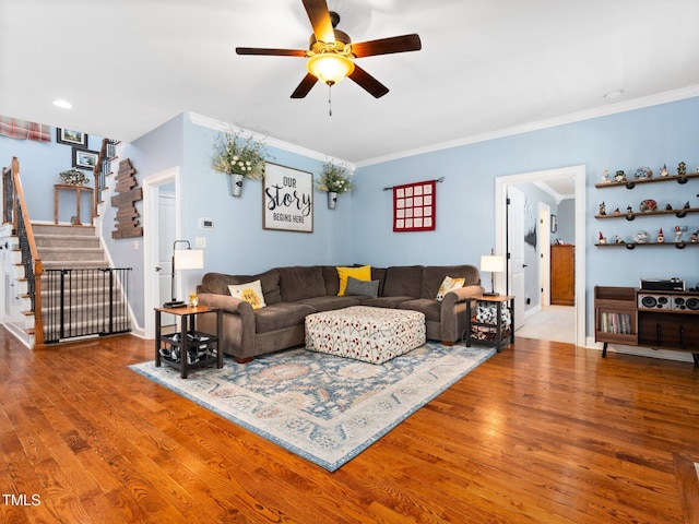 171 Winding Oak Way, Clayton, NC 27520 - living room featuring stairway, ceiling fan, wood finished floors, and ornamental molding