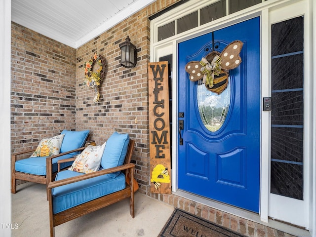 171 Winding Oak Way, Clayton, NC 27520 - view of exterior entry featuring brick siding and a porch