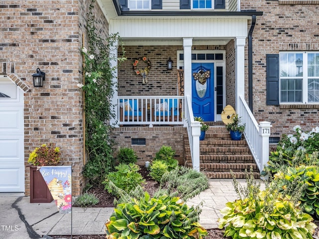 171 Winding Oak Way, Clayton, NC 27520 - entrance to property featuring brick siding and a porch