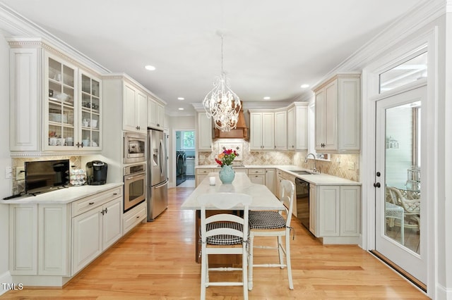 137 Forked Pine Ct, Chapel Hill, NC 27517 - kitchen featuring a chandelier, light countertops, decorative backsplash, light wood-style flooring, and recessed lighting