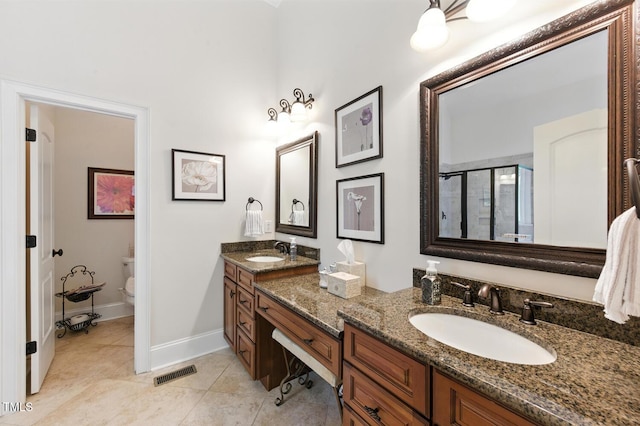 137 Forked Pine Ct, Chapel Hill, NC 27517 - full bath featuring double vanity, a shower stall, and tile patterned flooring