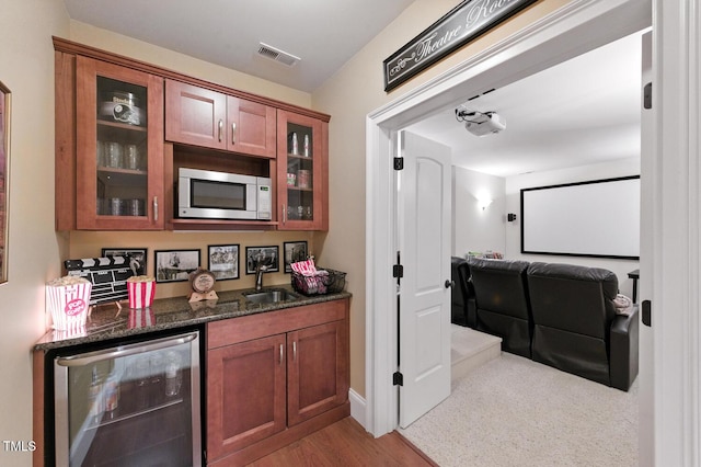 137 Forked Pine Ct, Chapel Hill, NC 27517 - indoor wet bar with beverage cooler and wood finished floors