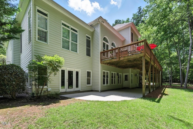 137 Forked Pine Ct, Chapel Hill, NC 27517 - back of house featuring french doors, a lawn, a deck, and a patio area