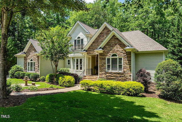 137 Forked Pine Ct, Chapel Hill, NC 27517 - craftsman inspired home with stone siding, a front lawn, and roof with shingles