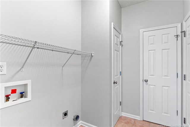1605 Stanford Ct, Fayetteville, NC 28314 - laundry area featuring hookup for a washing machine, hookup for an electric dryer, and light tile patterned floors