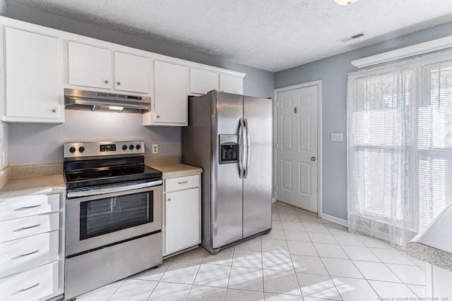 4105 Freedom Ln, Hope Mills, NC 28348 - kitchen featuring under cabinet range hood, appliances with stainless steel finishes, light countertops, white cabinets, and a textured ceiling