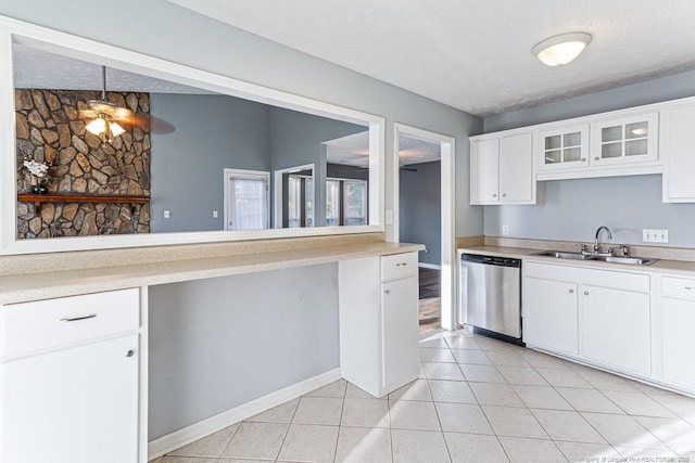4105 Freedom Ln, Hope Mills, NC 28348 - kitchen with dishwasher, light countertops, white cabinetry, and a textured ceiling