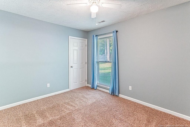 4105 Freedom Ln, Hope Mills, NC 28348 - carpeted empty room with a textured ceiling and a ceiling fan