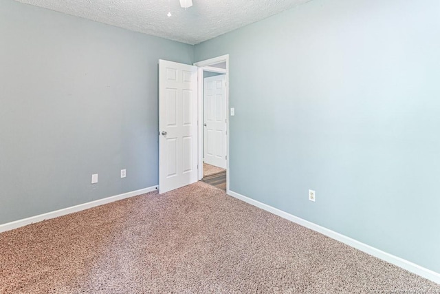 4105 Freedom Ln, Hope Mills, NC 28348 - spare room featuring carpet flooring and a textured ceiling