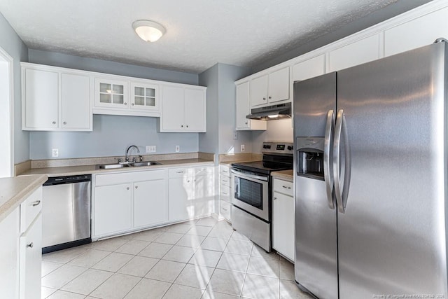 4105 Freedom Ln, Hope Mills, NC 28348 - kitchen featuring appliances with stainless steel finishes, under cabinet range hood, white cabinetry, light countertops, and a textured ceiling