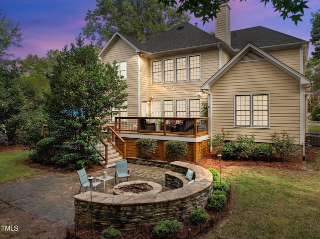 3608 Smoky Chestnut Ln, Raleigh, NC 27615 - back of property with an outdoor fire pit, a patio, a chimney, a deck, and stairway